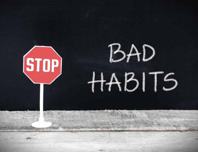 An illustration of bad habits being stopped by a red stop sign, representing the decision to break insidious habits in 2026.