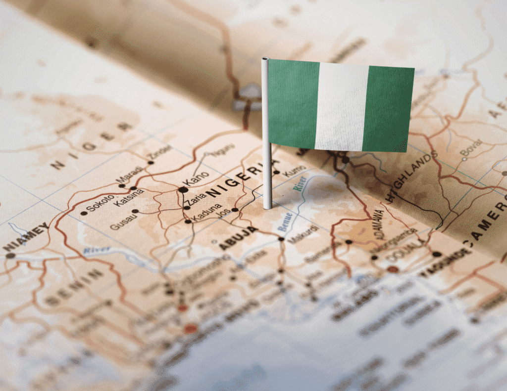 Map of Nigeria with Nigerian flag pin highlighting mental health NGOs across Nigeria